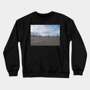 Wooden poles on the beach of Schiermonnikoog, Netherlands Crewneck Sweatshirt